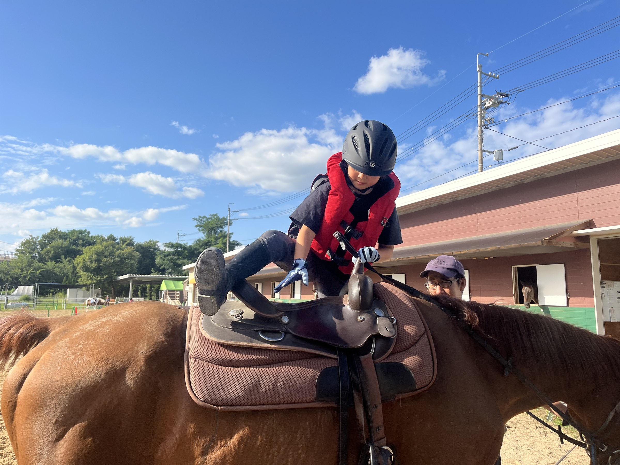 Mounting a horse at the riding stables